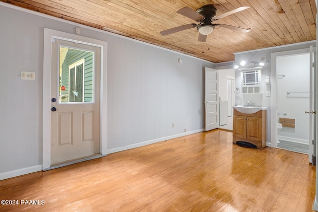 entryway with wood ceiling, light hardwood / wood-style floors, sink, ceiling fan, and ornamental molding