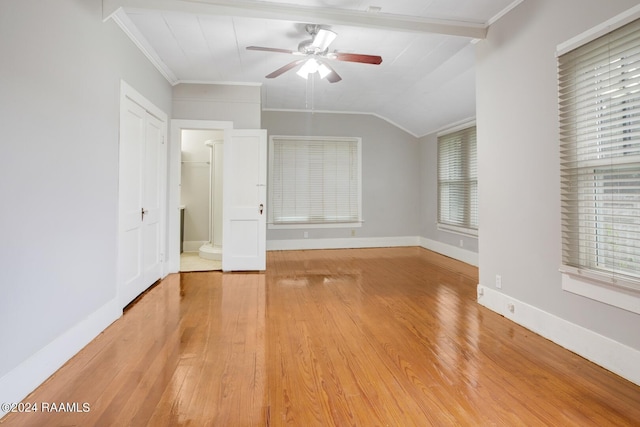 interior space featuring multiple windows, lofted ceiling, hardwood / wood-style floors, and ceiling fan