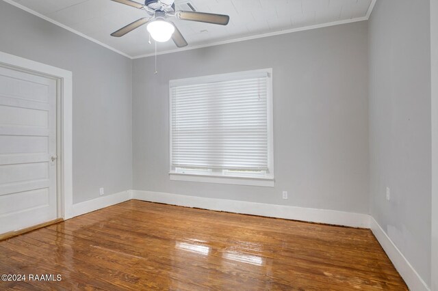 spare room featuring crown molding, ceiling fan, and hardwood / wood-style floors