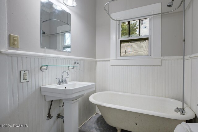 bathroom with tile patterned floors