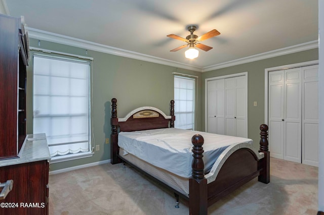 carpeted bedroom with multiple windows, crown molding, and ceiling fan