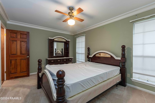 bedroom with light carpet, ceiling fan, and crown molding