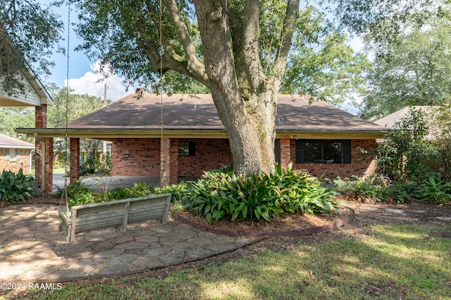 rear view of property featuring a patio