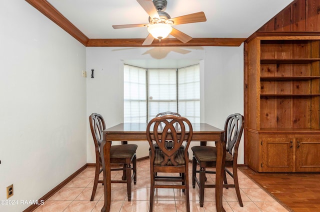 dining area with ornamental molding, ceiling fan, and light hardwood / wood-style flooring