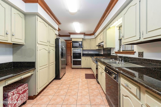 kitchen featuring light tile patterned floors, black appliances, dark stone counters, ornamental molding, and sink