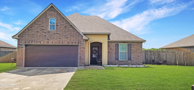 view of property featuring a front lawn