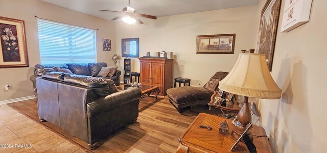 living room featuring light hardwood / wood-style flooring and ceiling fan