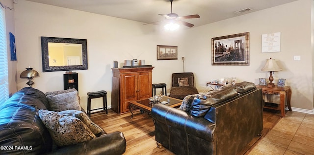 living room featuring ceiling fan and light tile patterned flooring