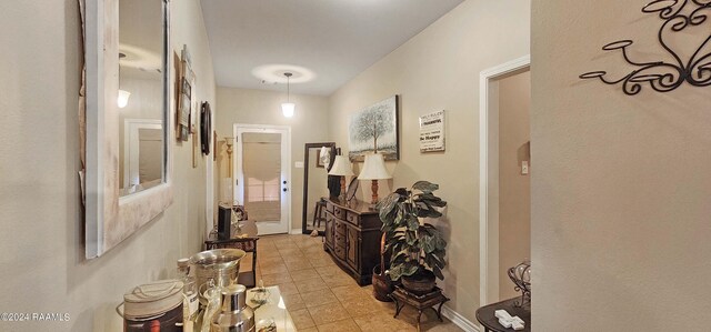 hallway featuring light tile patterned floors