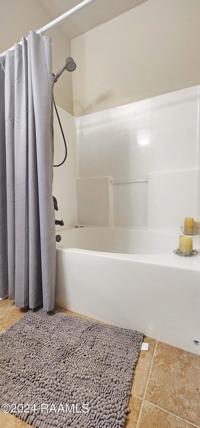 bathroom with shower / bathtub combination with curtain