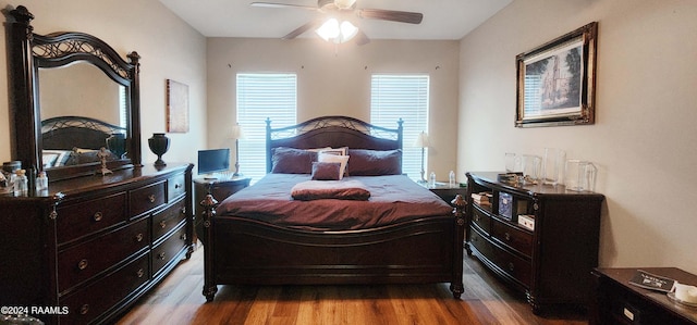 bedroom with wood-type flooring and ceiling fan