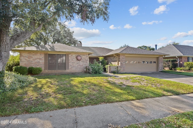 single story home with a front yard and a garage