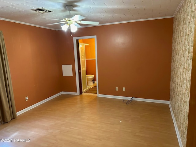 spare room featuring ceiling fan, light hardwood / wood-style flooring, and ornamental molding