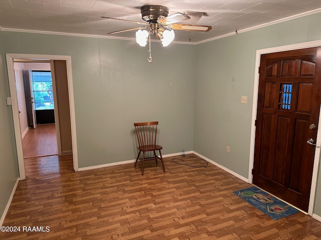 foyer entrance featuring crown molding, ceiling fan, and hardwood / wood-style flooring