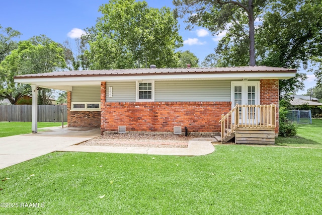 155 Emerite Dr, Lafayette, LA 70506 - view of front of property featuring brick siding, concrete driveway, a carport, and metal roof