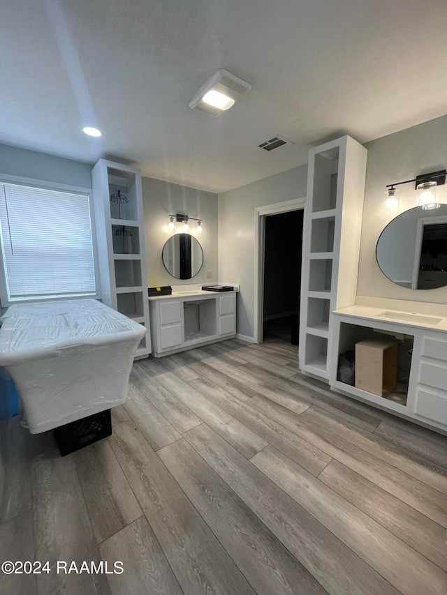 bathroom with vanity and hardwood / wood-style floors