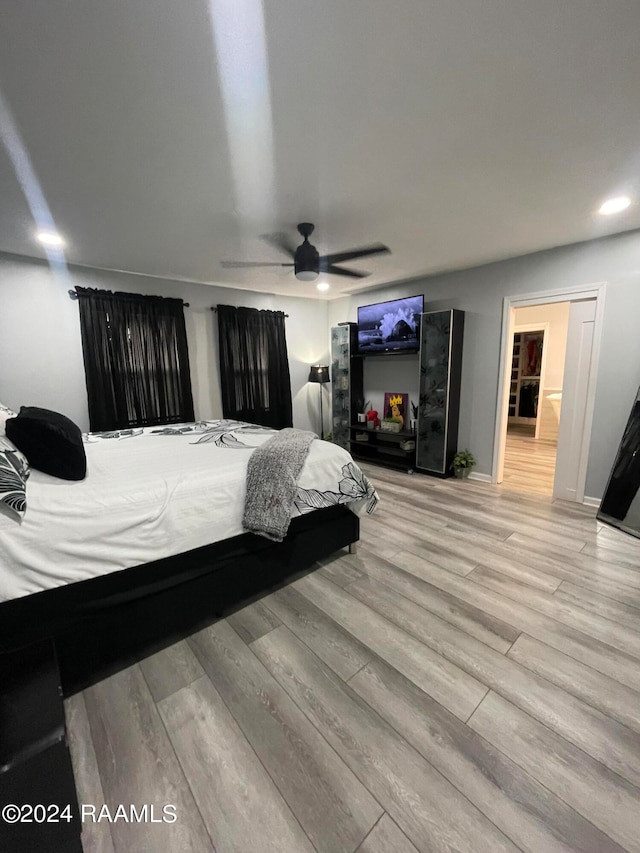 bedroom featuring light wood-type flooring and ceiling fan