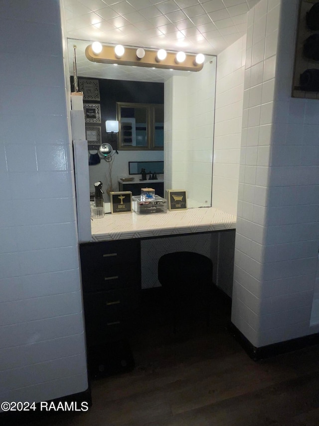 bathroom with vanity and hardwood / wood-style flooring