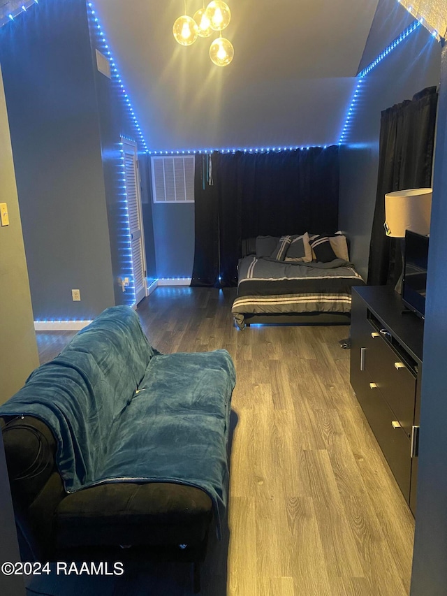 bedroom with hardwood / wood-style flooring