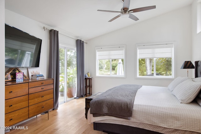 bedroom featuring light wood-style floors, lofted ceiling, a ceiling fan, and access to outside