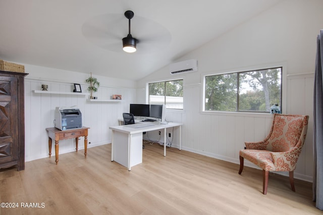 office featuring ceiling fan, light wood-type flooring, vaulted ceiling, and an AC wall unit