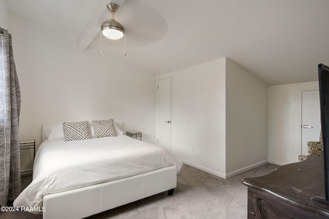 carpeted bedroom featuring lofted ceiling and ceiling fan