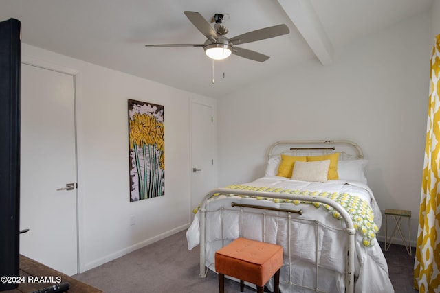 carpeted bedroom featuring beam ceiling, baseboards, and ceiling fan