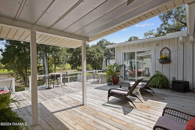 wooden deck with outdoor dining space