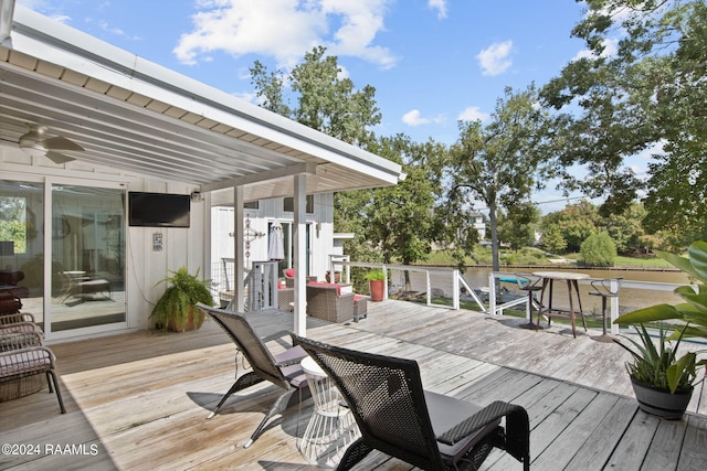 wooden terrace featuring ceiling fan
