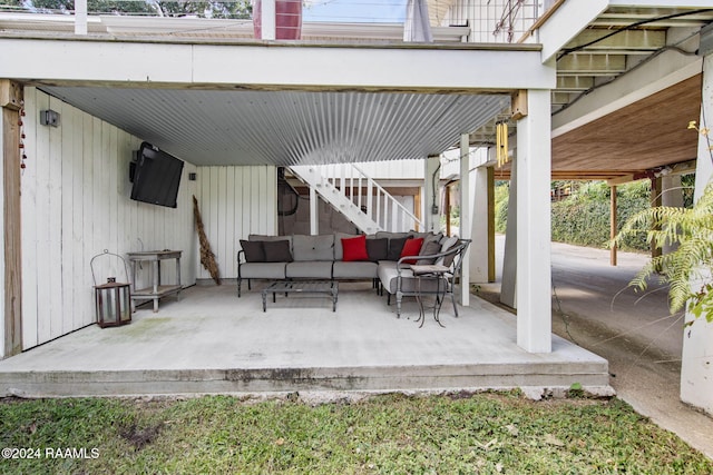 view of patio / terrace featuring outdoor lounge area and stairway