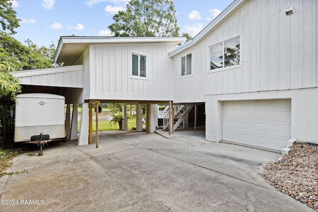 view of front of home featuring a garage and a carport