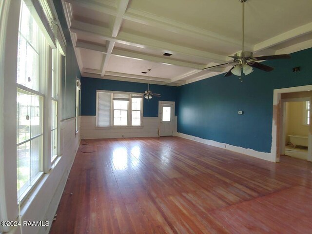 unfurnished room with ceiling fan, hardwood / wood-style flooring, beam ceiling, and coffered ceiling