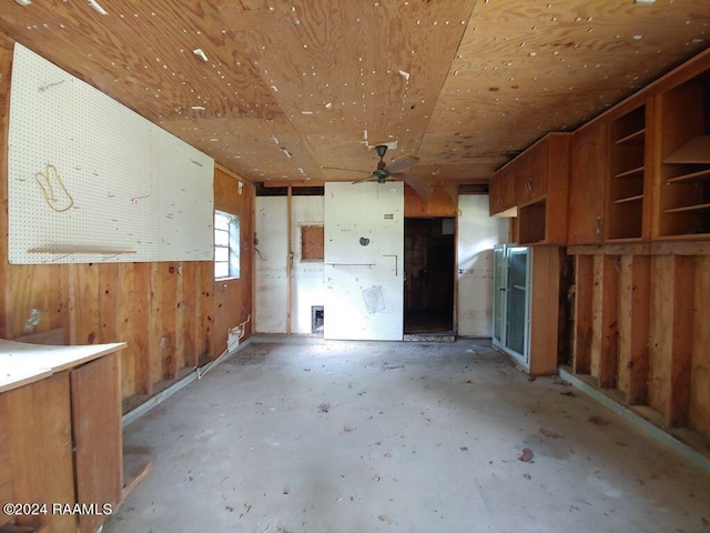 misc room featuring wooden walls