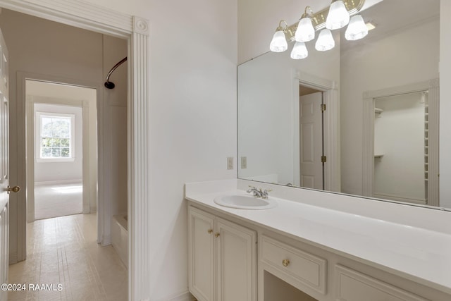 bathroom with vanity, shower / bathing tub combination, and hardwood / wood-style flooring