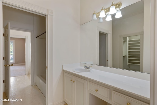 bathroom featuring tub / shower combination and vanity