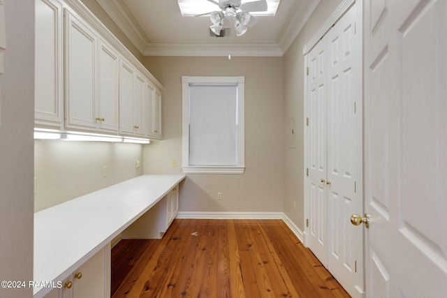 interior space featuring light hardwood / wood-style flooring, ceiling fan, and crown molding