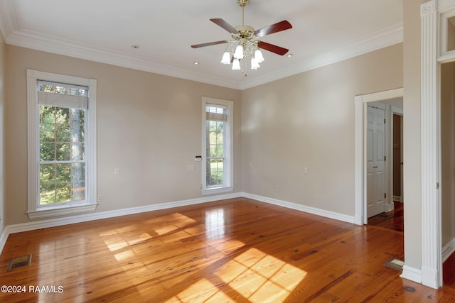 spare room featuring ceiling fan, light hardwood / wood-style flooring, and crown molding