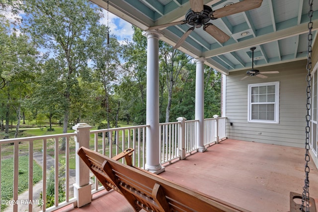 wooden deck featuring ceiling fan