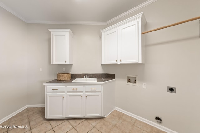 laundry area with cabinets, hookup for an electric dryer, sink, and crown molding