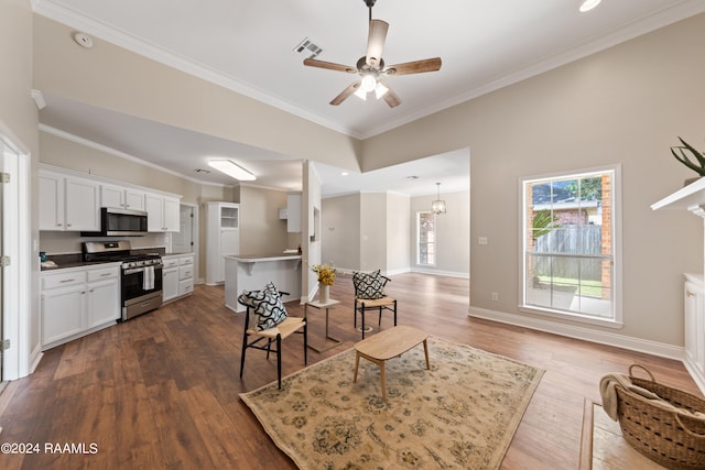 interior space with ceiling fan with notable chandelier, dark hardwood / wood-style floors, and ornamental molding