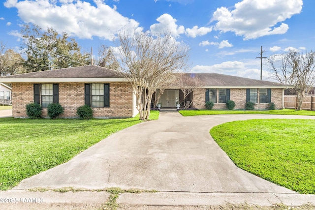 ranch-style home with a front lawn