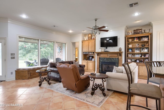 110 River Wood Pl, Abbeville, LA 70510 - living room with a ceiling fan, light tile patterned floors, ornamental molding, a high end fireplace, and recessed lighting
