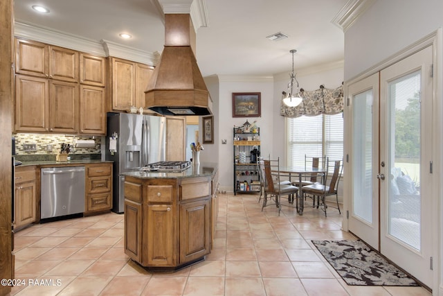 kitchen featuring pendant lighting, custom exhaust hood, light tile patterned floors, french doors, and stainless steel appliances