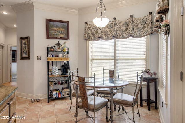 110 River Wood Pl, Abbeville, LA 70510 - dining room featuring crown molding, light tile patterned flooring, and baseboards