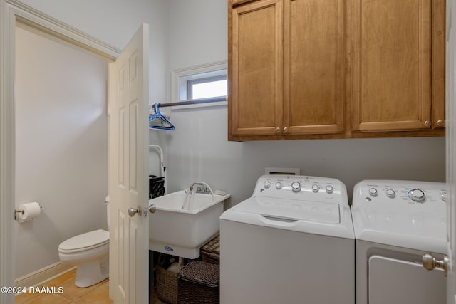 110 River Wood Pl, Abbeville, LA 70510 - laundry area featuring washer and dryer, light tile patterned flooring, and baseboards
