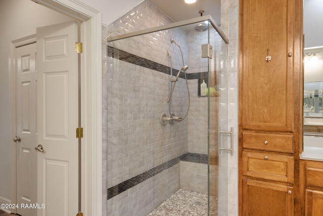 bathroom with a shower with shower door