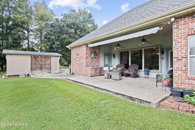110 River Wood Pl, Abbeville, LA 70510 - view of patio with ceiling fan and an outbuilding