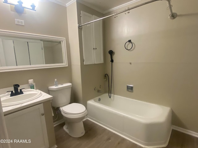 full bathroom featuring shower / tub combination, hardwood / wood-style flooring, toilet, ornamental molding, and vanity