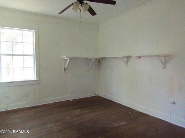 spare room with ornamental molding, ceiling fan, and dark hardwood / wood-style flooring