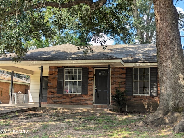 ranch-style house with a carport